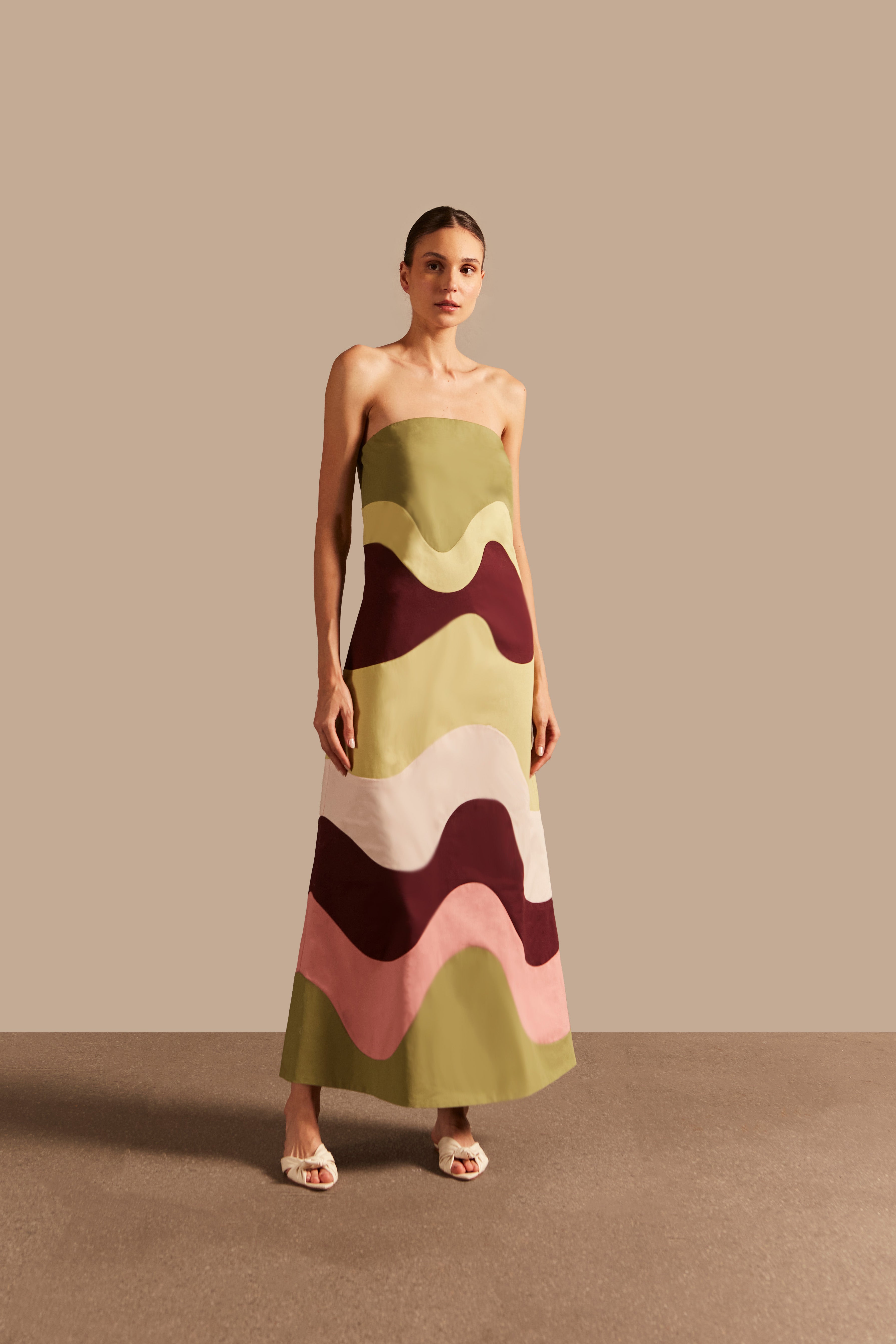 Model wearing the  Giardino Solid Strapless Long Dress Front showcasing its Green/Pink/Brown/Salmon color on 98% Cotton 2% Elastane fabric, styled for an afternoon look.  
