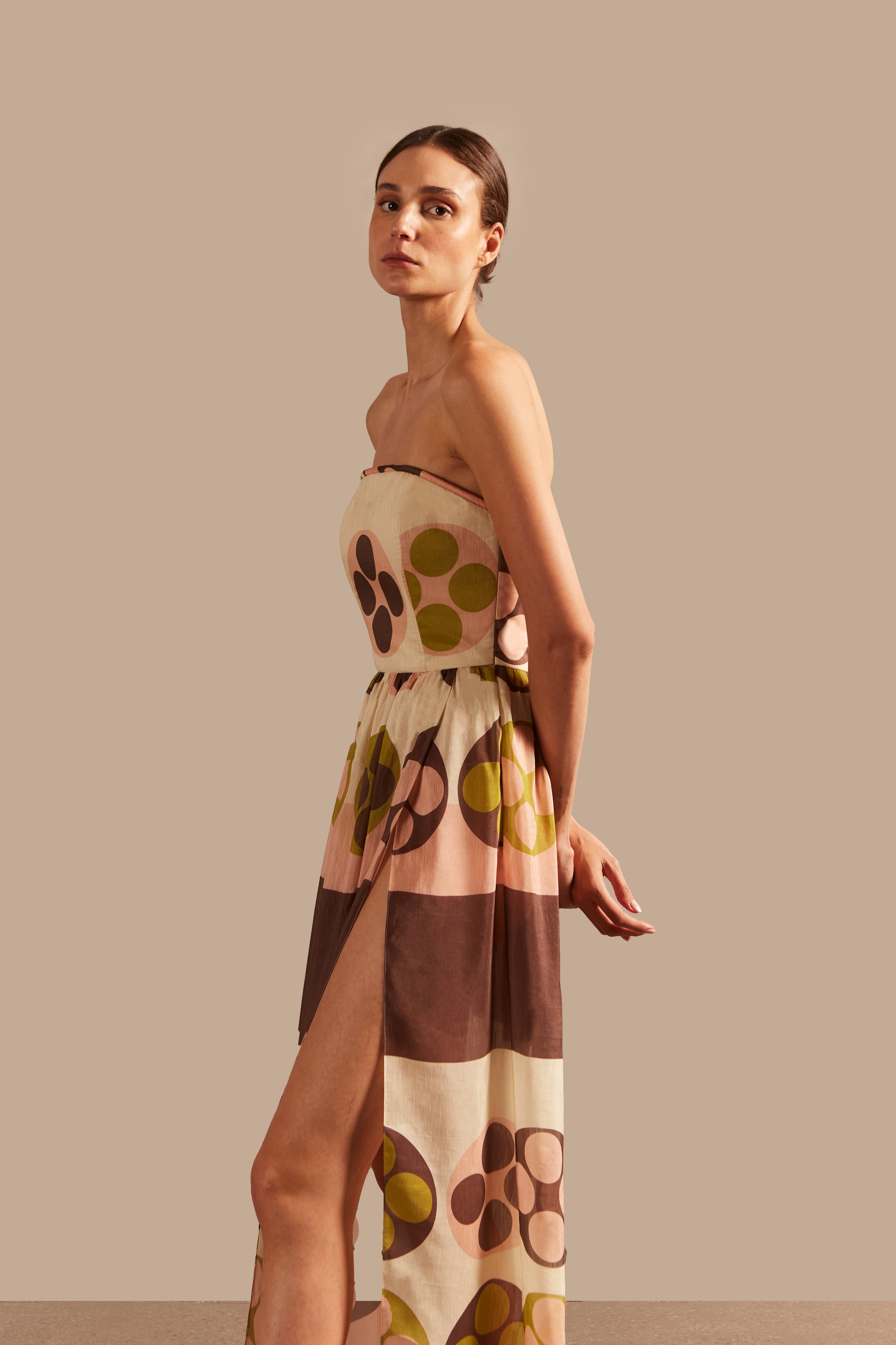 Model wearing the Giardino Strapless Long Dress Detail showcasing its Unique color on 64% Linen 36% Silk fabric, styled for an afternoon look.  