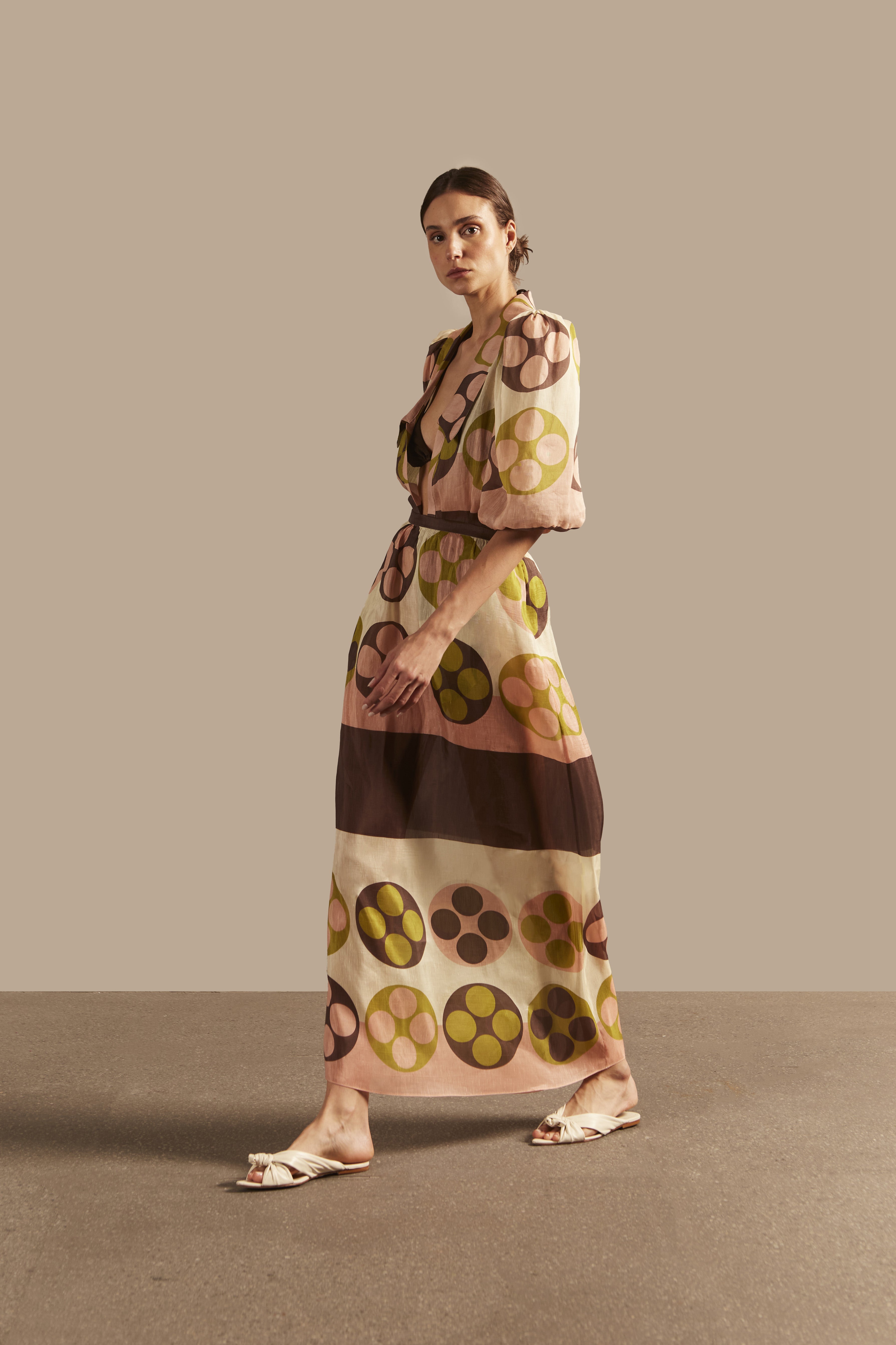 Model wearing the Giardino Long Skirt Concept showcasing its Unique color on 64% Linen 36% Silk fabric, styled for an afternoon look.   