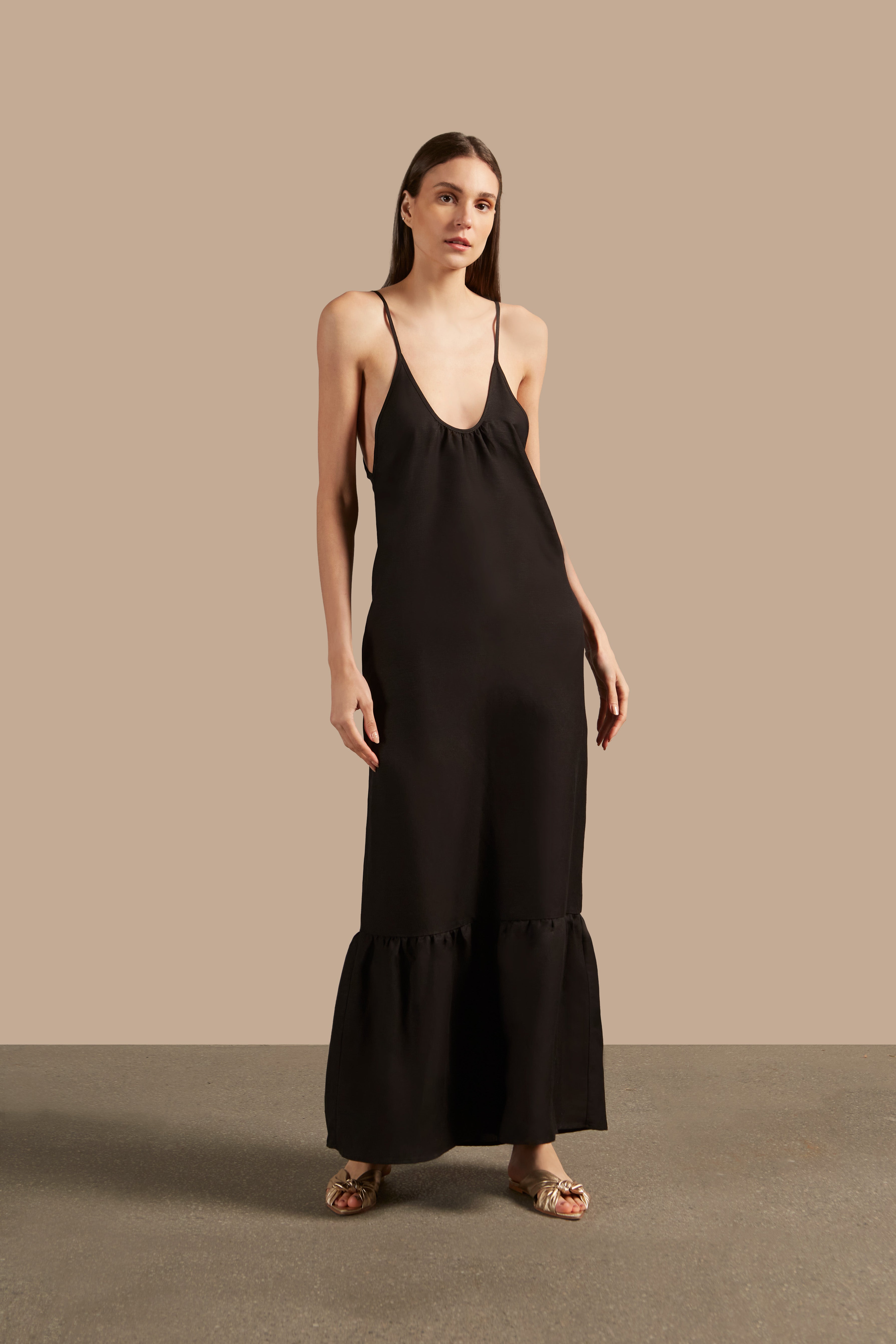 Full front view of the Golden Age Solid Straps Long Dress in black with thin straps and flowing design.