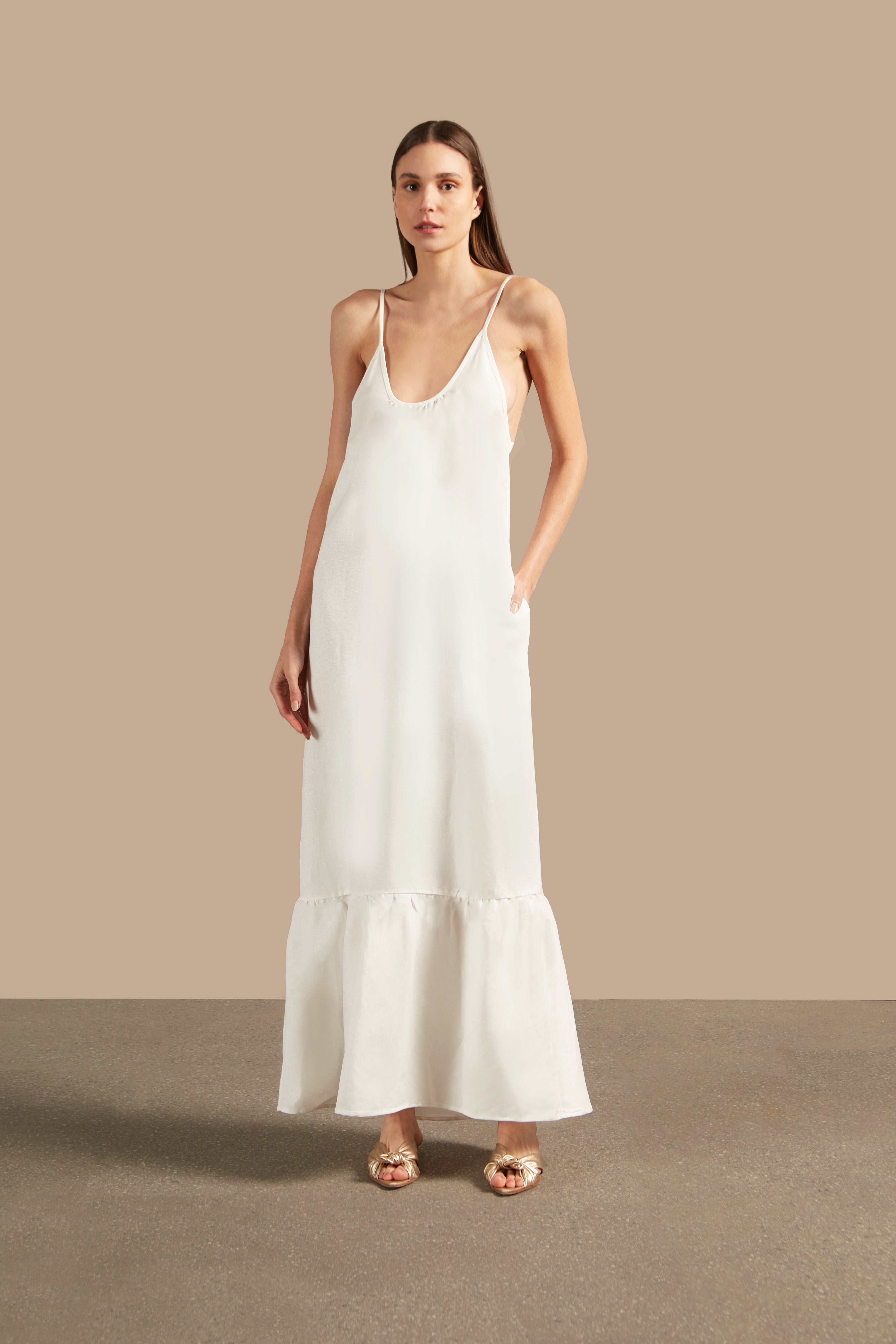 Full front view of the Golden Age Solid Straps Long Dress in off-white with thin straps and fluid silhouette.