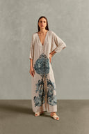 Model wearing the Hera Buttoned Long Robe Front showcasing its vintage references with Off White print on 100% Viscose fabric, styled for a resort look. 