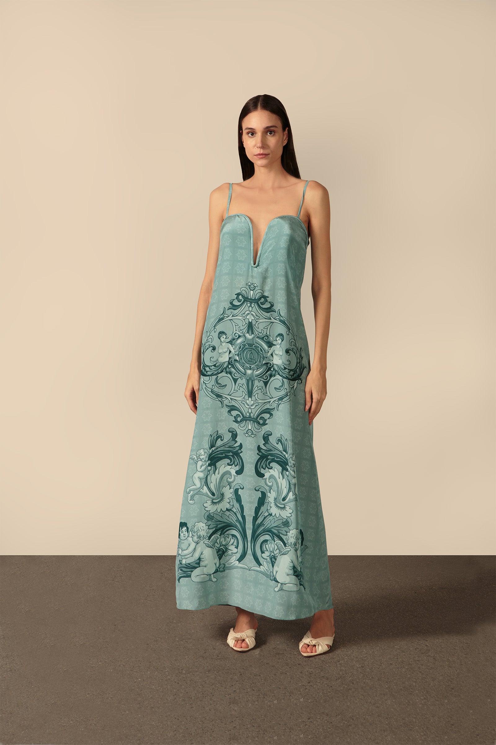 Model wearing the Hera Deep-V Long Dress Front showcasing its Blue color on 100% Silk fabric.  