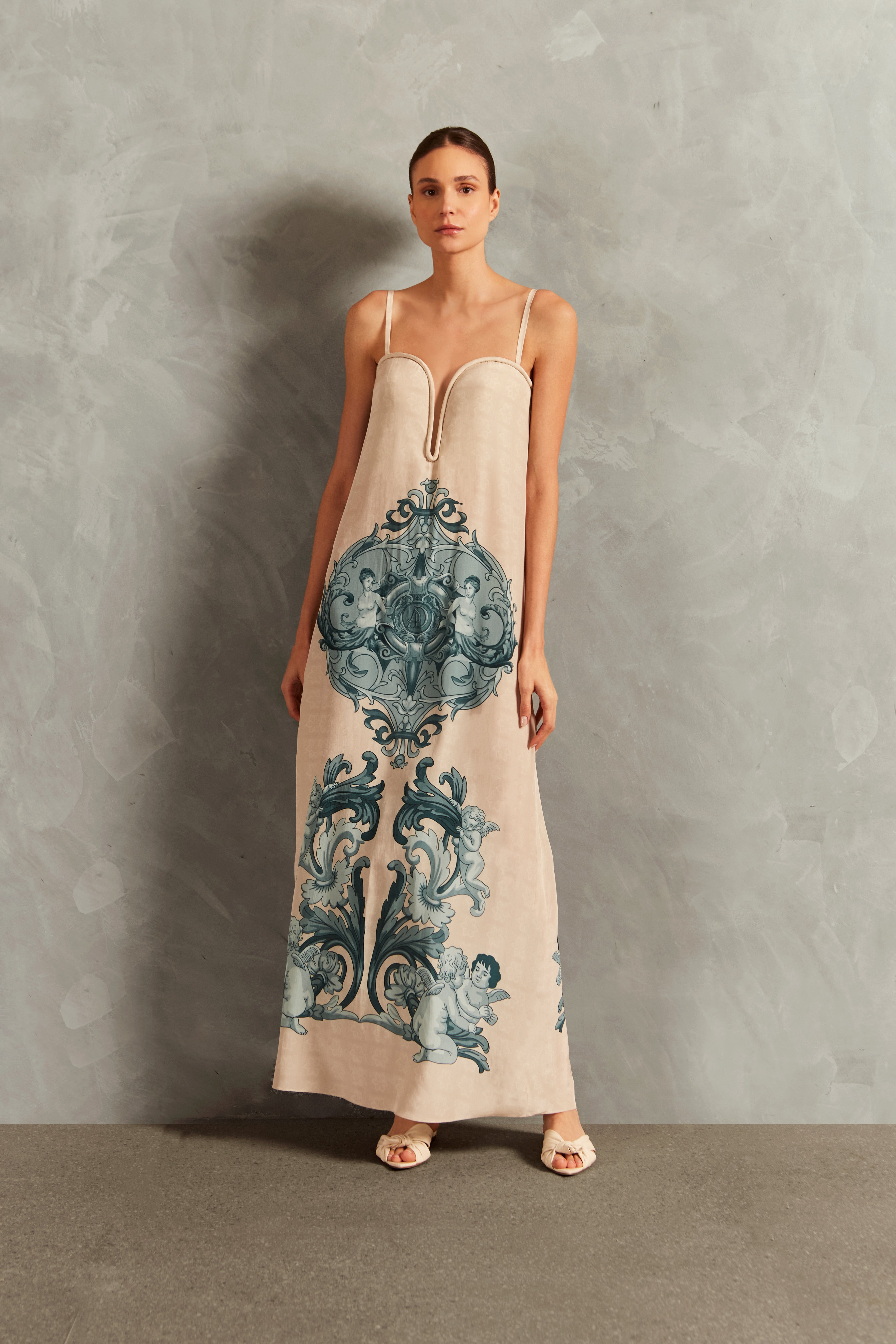 Model wearing the Hera Deep-V Long Dress Front showcasing its Off White color on 100% Silk fabric.  