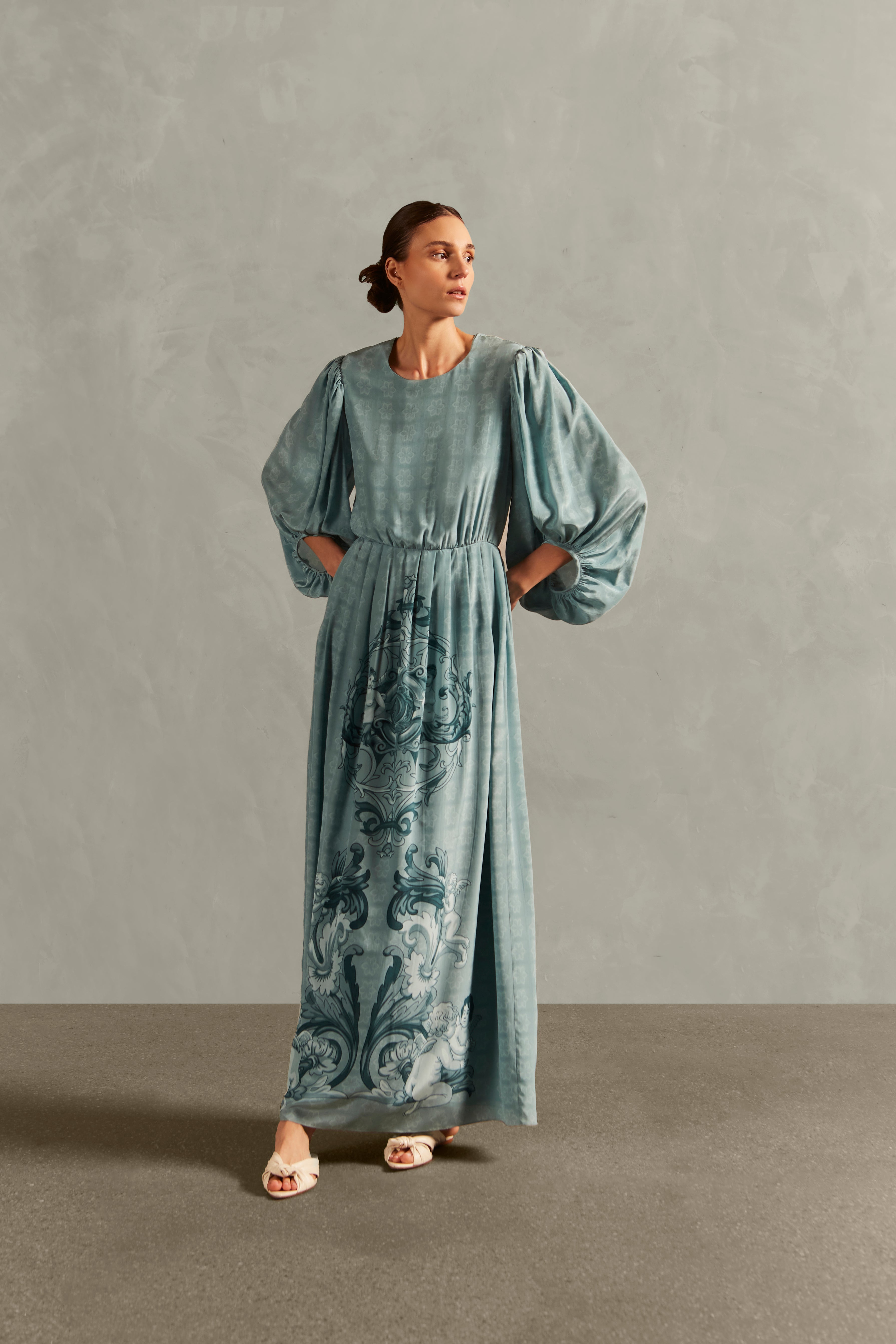 Model wearing the Hera Puff-Sleeved Long Dress Front showcasing its Blue color on 100% Silk fabric.  