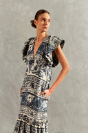 Model wearing the Hera Ruffled Long Dress color blue detail, with 100% viscose fabric, styled for a resort look