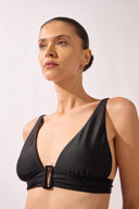 Model wearing the High-Leg Belted Bikini detail top color black, made from 85% polyamide 15% elastane, styled for a beachwear look