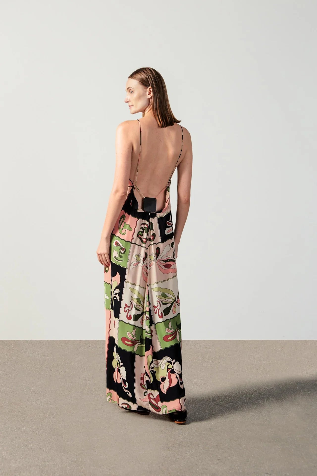 Model wearing the Inamorata Bare Back Maxi Dress back with 100% viscose fabric styled for a lunch look