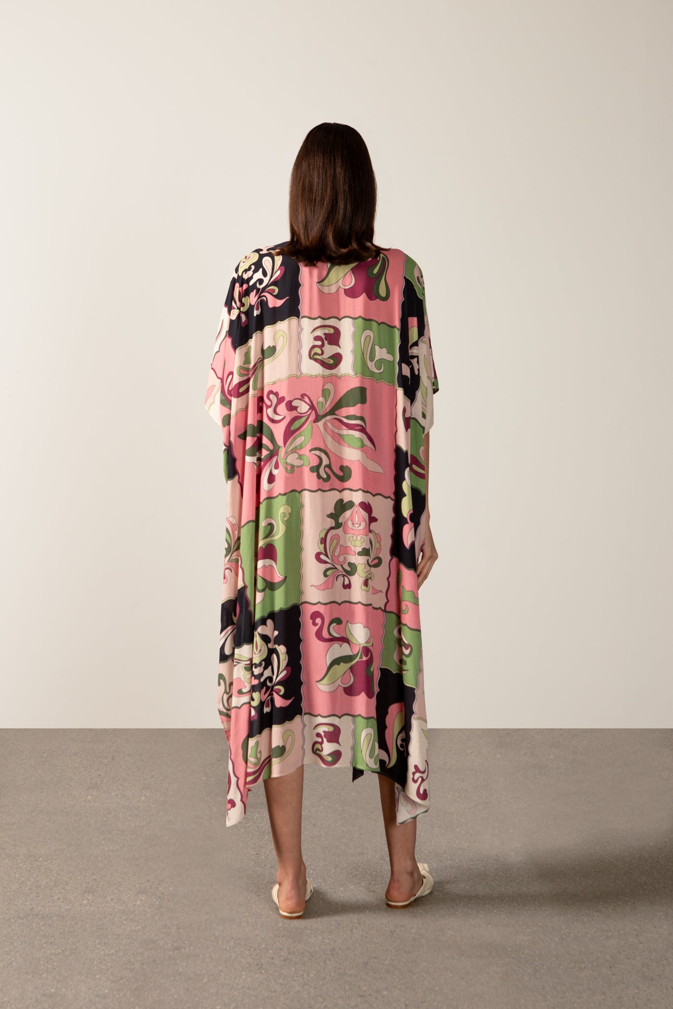 Model wearing the Inamorata Maxi Robe back  in pink color with 100% viscose fabric styled for a post beach look