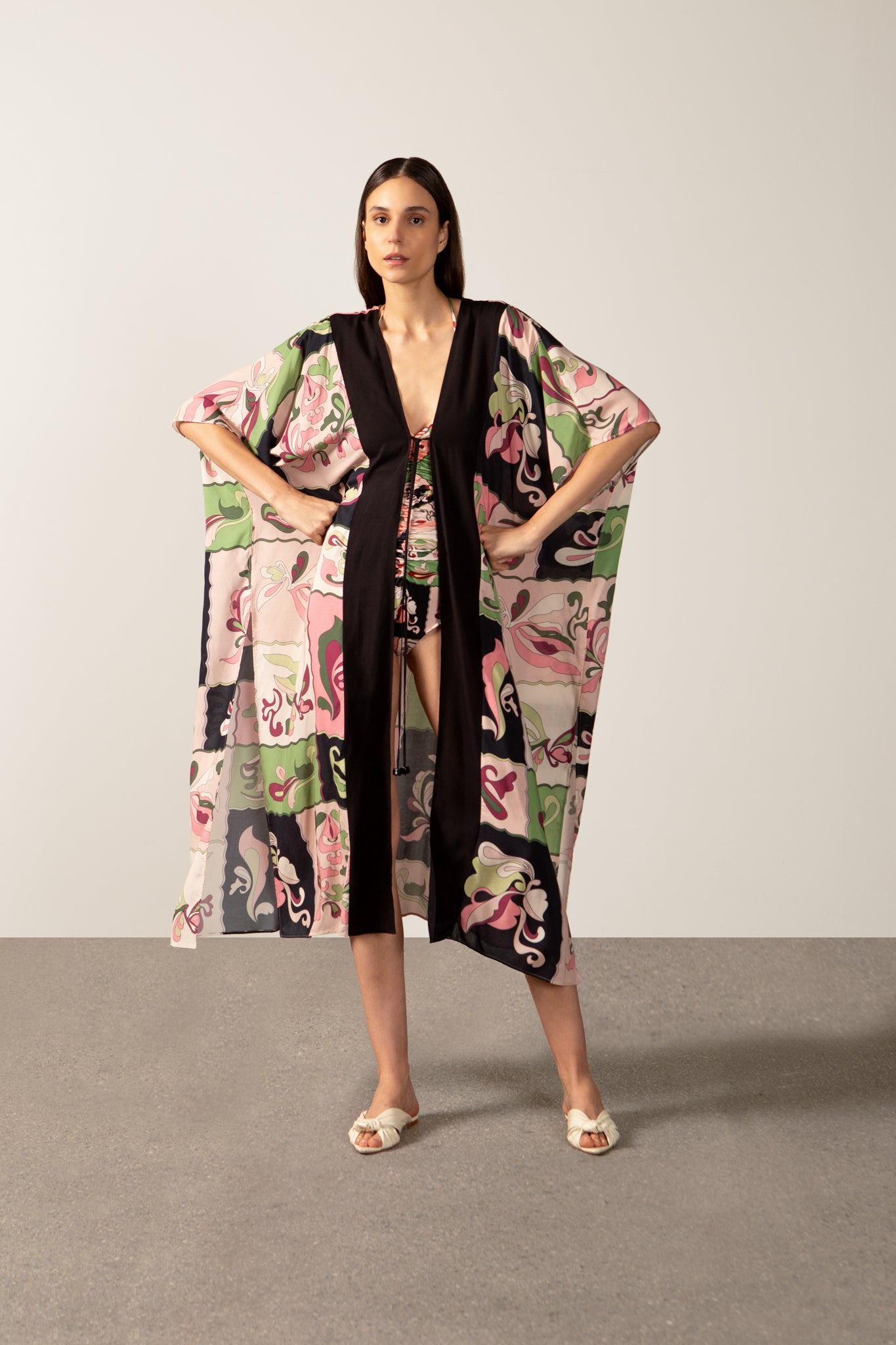 Model wearing the Inamorata Maxi Robe  in pink color with 100% viscose fabric styled for a post beach look