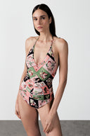 Model wearing the Inamorata Ruched Swimsuit look color pink with 85% Polyamide 15% Elastane styled for a beachwear look  