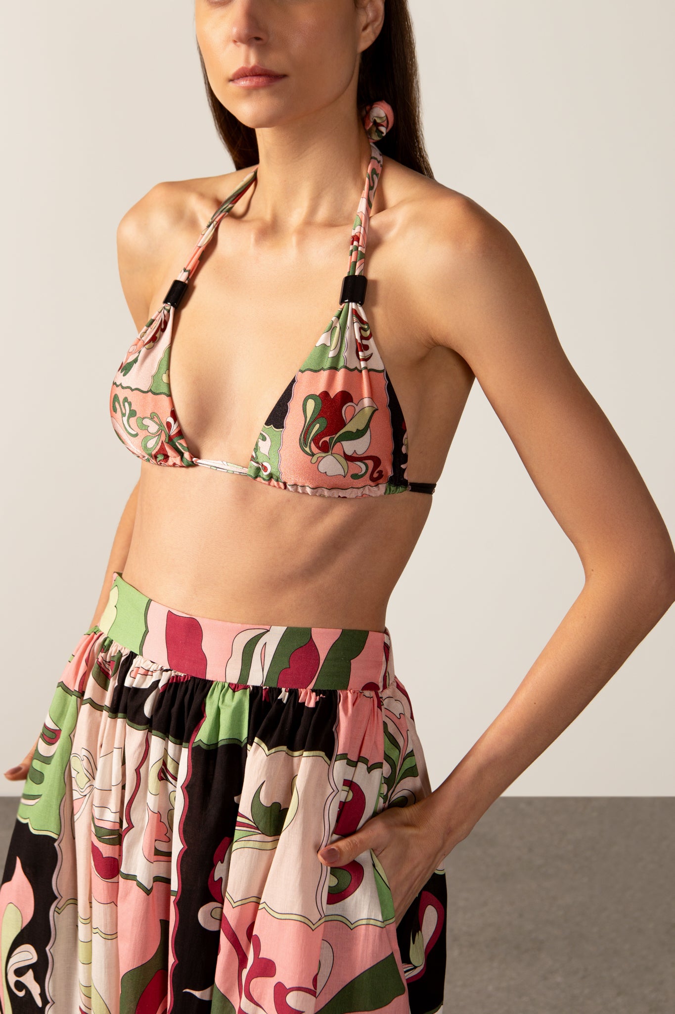Model wearing the Inamorata Side-Slit Maxi Skirt detail color pink made with 100% cotton, styled for resortwear look 
