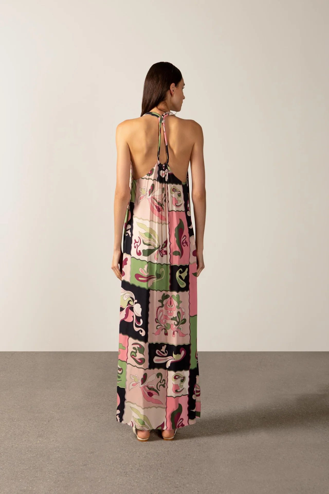 Model wearing the Inamorata Straps Maxi Dress back with 100% viscose fabric styled for a resort look