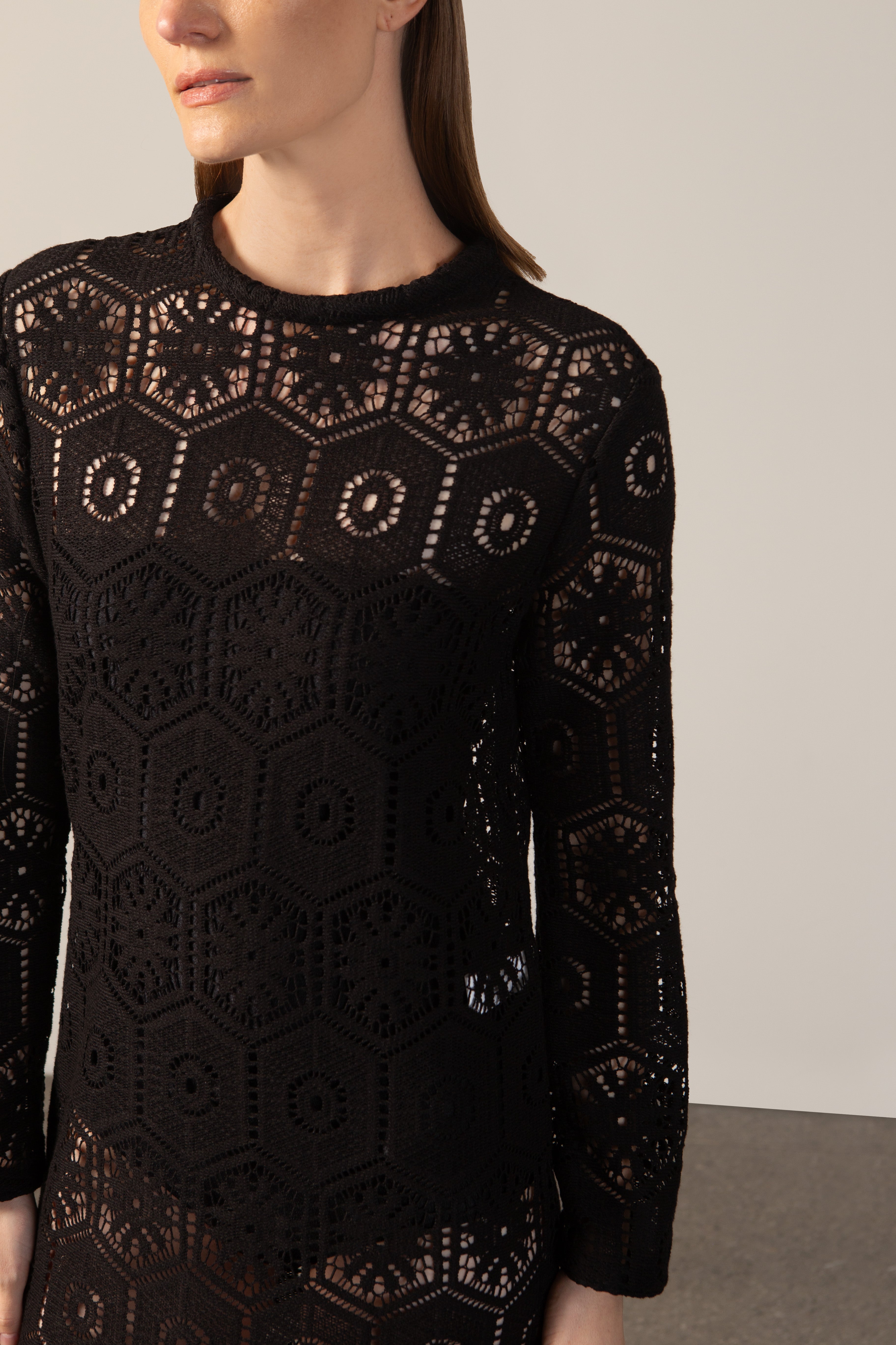 Model wearing the  Lace Long-Sleeved Dress Detail showcasing its Black color on 80% Polyester 20% Cotton fabric.  