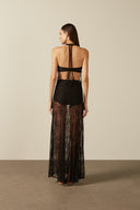 Model wearing the Lace Bare-Back Long Dress black back from the HS25 with 56% Polyamide 44% Cotton styled for a dinner and drinks look.   