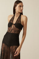 Model wearing the Lace Bare-Back Long Dress black front detail the HS25 with 56% Polyamide 44% Cotton styled for a dinner and drinks look.   