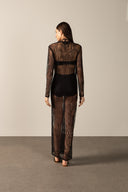 Model wearing the Lace Plunge-Neck Long Dress black back from the HS25 with 100% polyamide styled for a dinner and drinks look.  