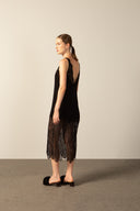 Model wearing the Lace Short Dress black back from the HS25 with 100% viscose styled for a dinner and drinks look.  