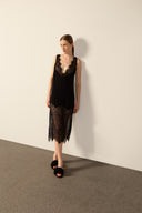 Model wearing the Lace Short Dress black front from the HS25 with 100% viscose styled for a dinner and drinks look.  