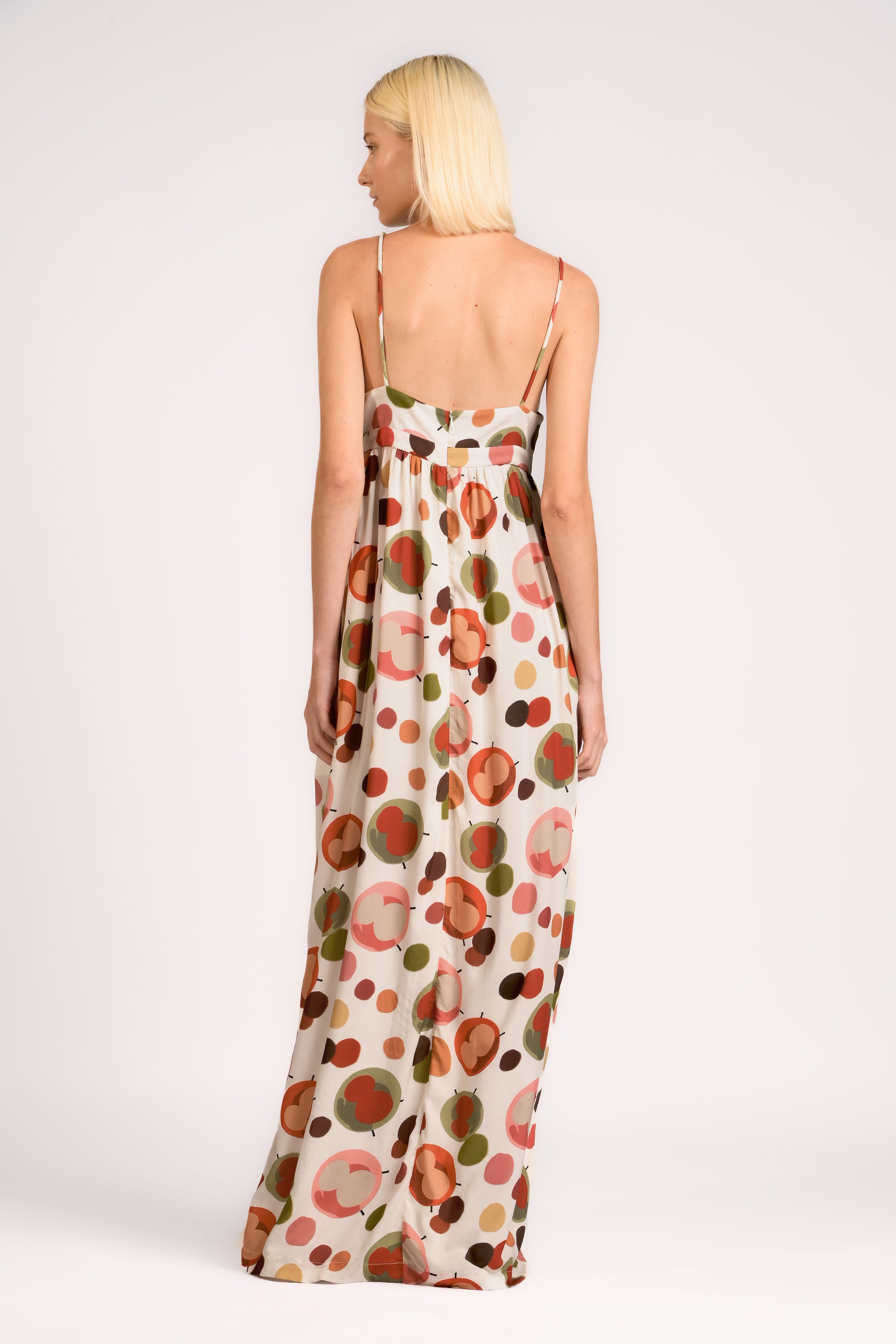 Model wearing the Lina Maxi Dress back color unique, made from 100% viscose, styled for resort look 