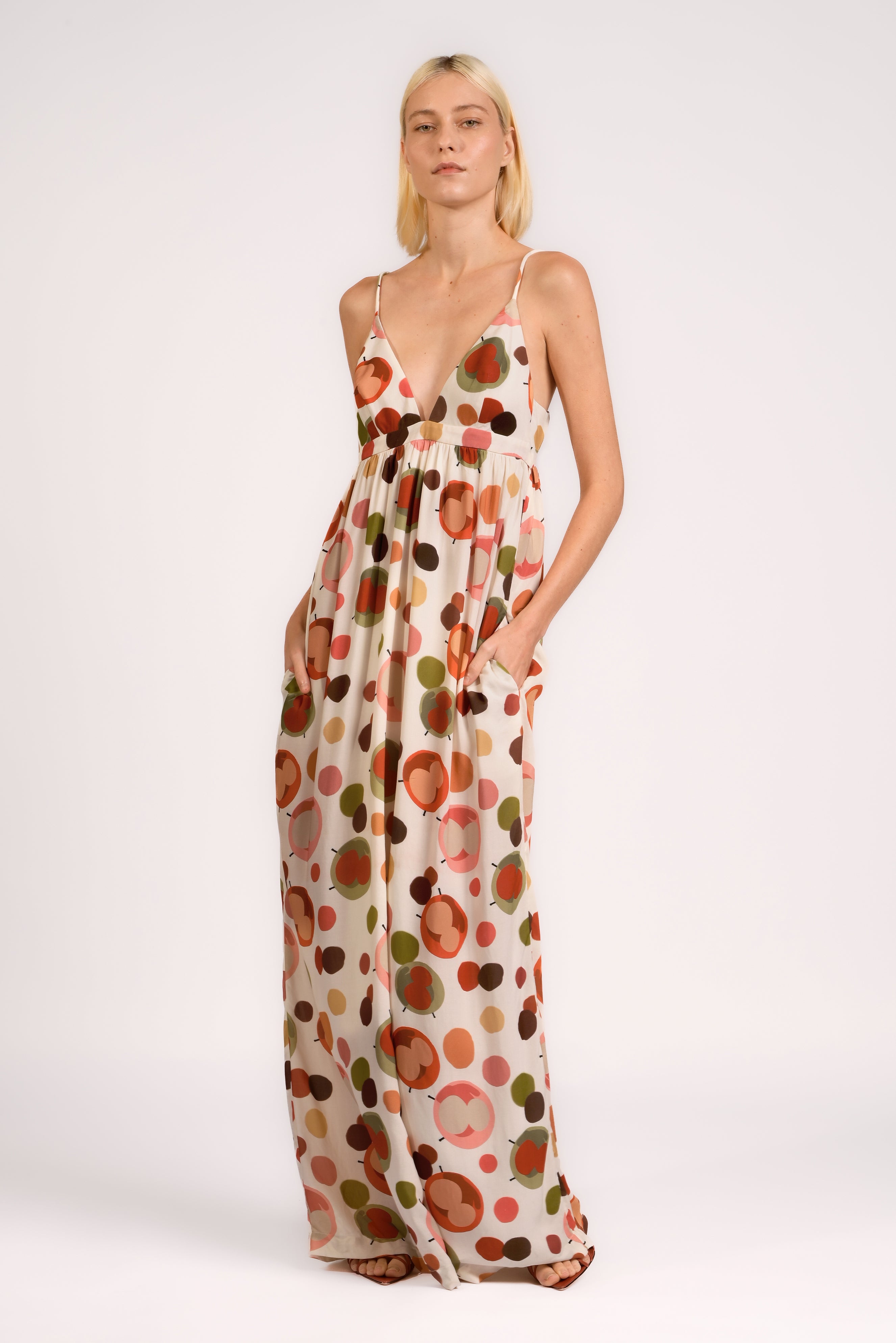 Model wearing the Lina Maxi Dress front color unique, made from 100% viscose, styled for resort look 