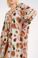 Model wearing the Lina Maxi Robe detail color unique, made from 100% viscose, styled for beachwear look 