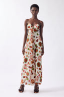 Model wearing the Lina Off-The-Shoulder Maxi Dress Front color unique, made from 80% viscose 20% silk, styled for a dinner look 