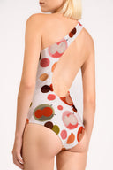 Model wearing the Lina One Shoulder Swimsuit back color unique, made from 85% polyester 15% elastane, styled for beachwear look 