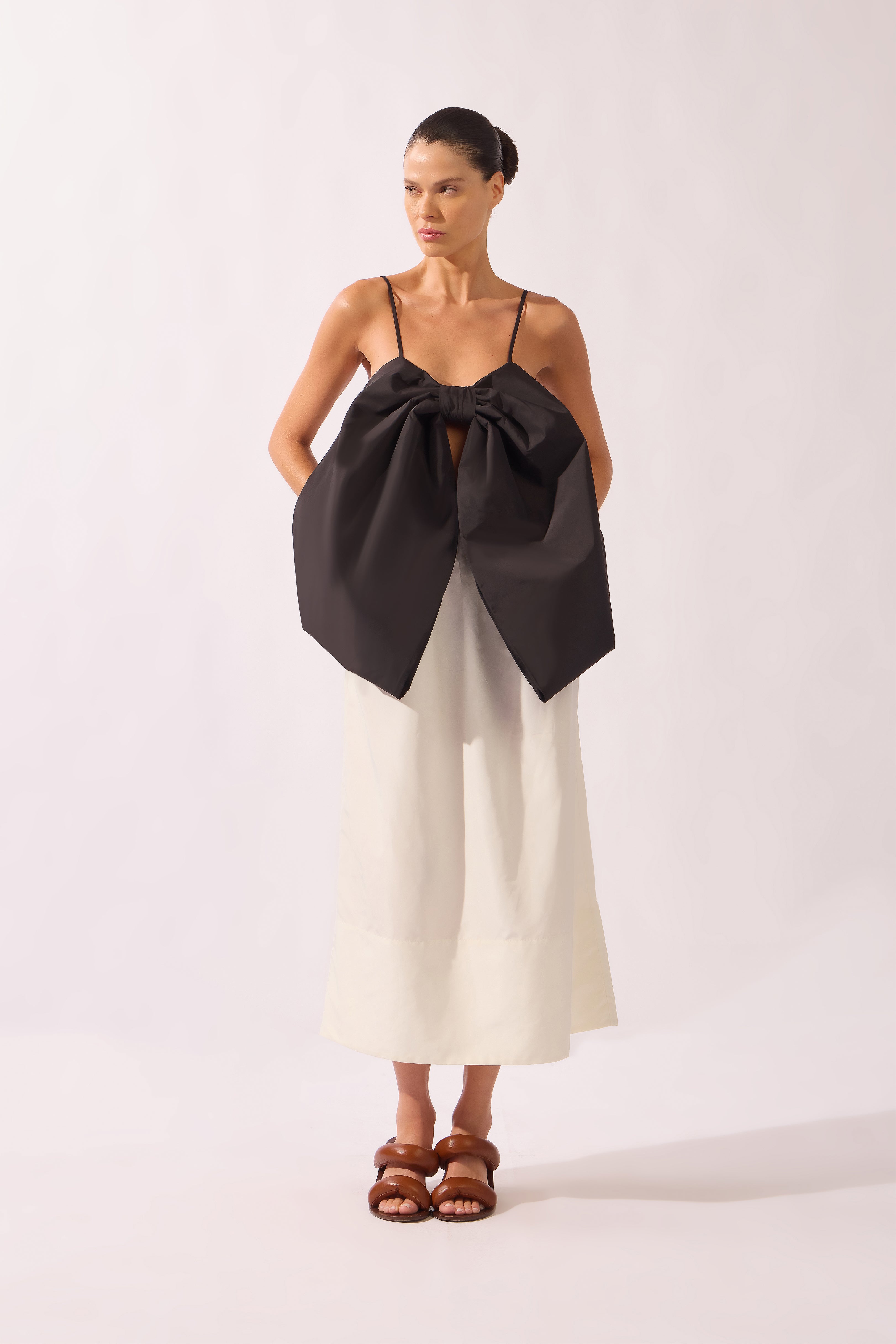 Model wearing the Solid Maxi Skirt look color black, made from 95% polyester 05% elastane, styled for a dinner look