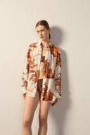 Model wearing the Men's Long Sleeve Viscose Shirt styled for a resort look