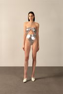 Model wearing the  Metallic Cut-Out Halterneck Swimsuit silver front from the HS25 with 92% POLYESTER 8% ELASTANE styled for a pool party look.  