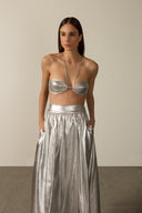 Model wearing the Metallic Top and Skirt Set detail in silver styled for a night drink