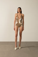 Model wearing the Metallic V-Neck Swimsuit gold front from the HS25 with 92% POLYESTER 8% ELASTANE styled for a pool party look.   