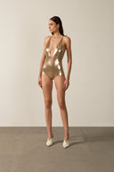 Model wearing the Metallic V-Neck Swimsuit gold pose from the HS25 with 92% POLYESTER 8% ELASTANE styled for a pool party look.   