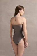 Model wearing the Mobile Apliqué Grey Swimsuit Back showcasing its vintage aesthetic with grey print on  85% polyamide15% spandex fabric.