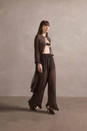 Model wearing the Mobile Midi Robe With Pants showcasing its contemporary elements with coffee print on 100% silk fabric, styled for a night look.