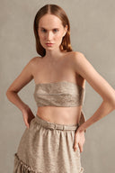 Model wearing the Moon Shine Strapless Top Front showcasing its Silver print on 58% Polyester 28% Cotton 9% Viscose 5% Acrilic fabric, styled for an evening look.  