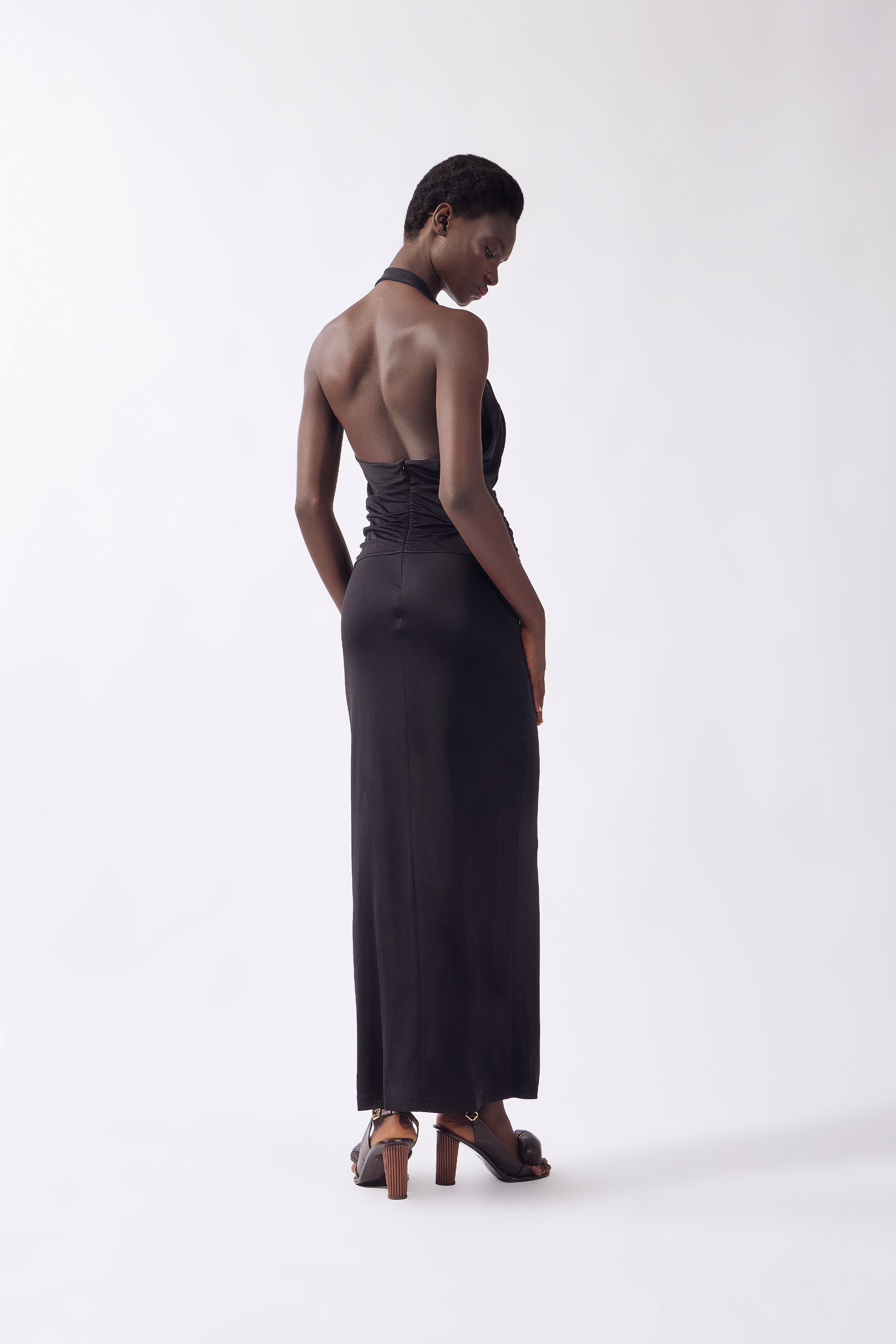 Model wearing the Nautilus Plunge Maxi Dress back, made from 96% viscose 4% elastane, styled for a night out look