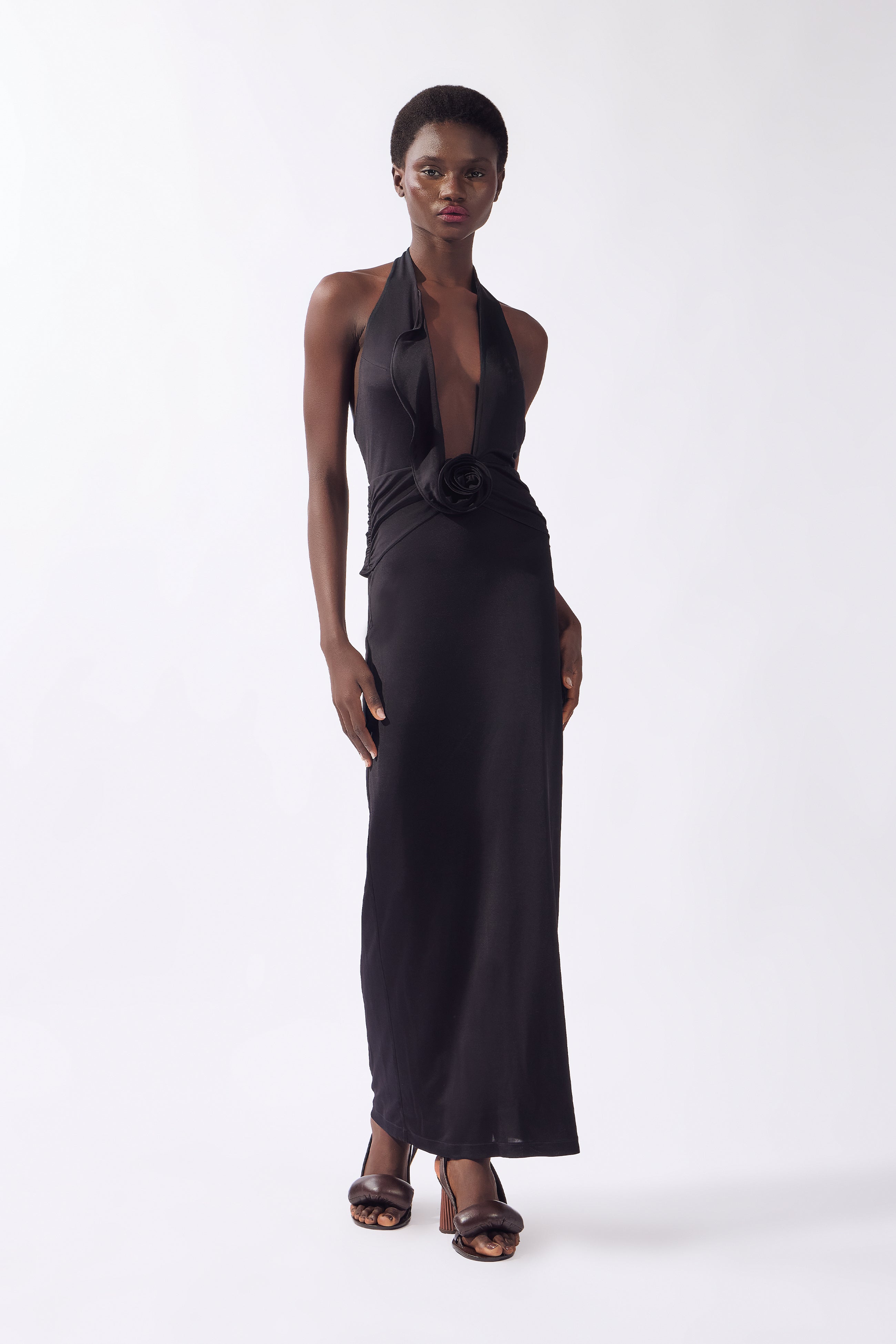Model wearing the Nautilus Plunge Maxi Dress front, made from 96% viscose 4% elastane, styled for a night out look
