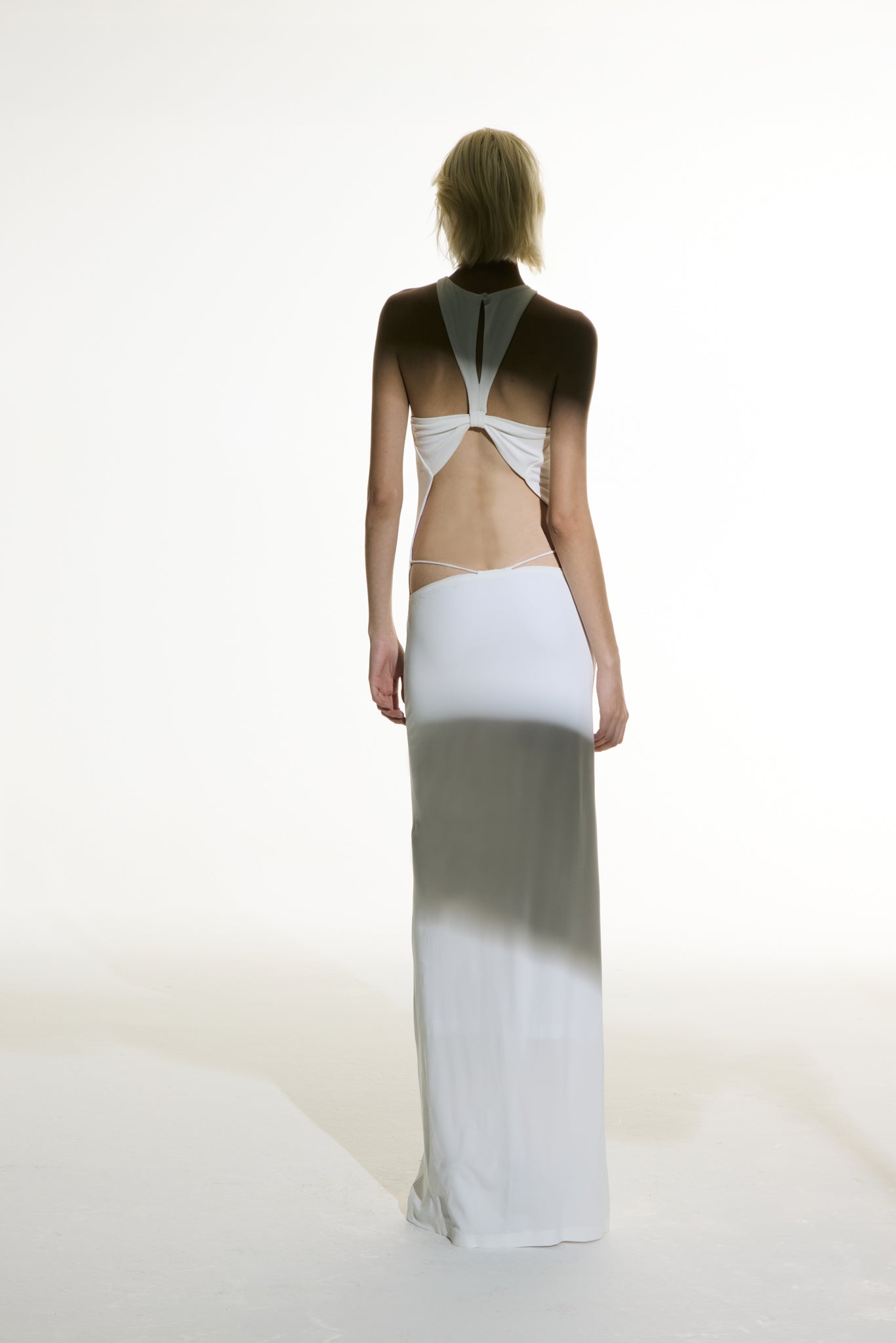 Model wearing the Open Back Maxi Dress off white back from the Adriana Degreas and Sabine Getty collab with 96% Viscose 4% Elastane styled for a evening look.