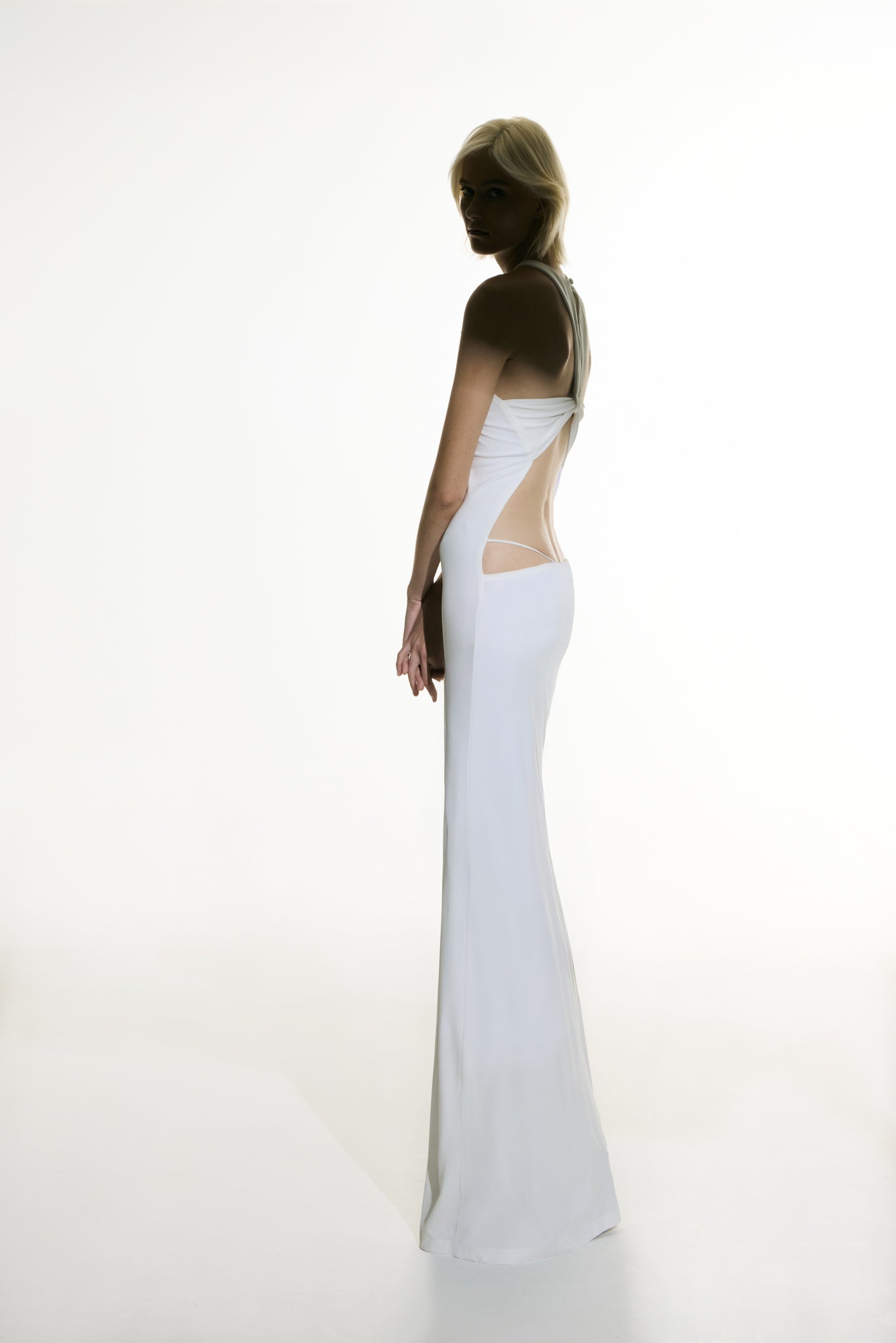 Model wearing the Open Back Maxi Dress off white detail from the Adriana Degreas and Sabine Getty collab with 96% Viscose 4% Elastane styled for a evening look.