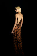 Model wearing the Open Back Silk Slip Dress back from the Adriana Degreas and Sabine Getty collab with 100% Silk styled for a casual look.