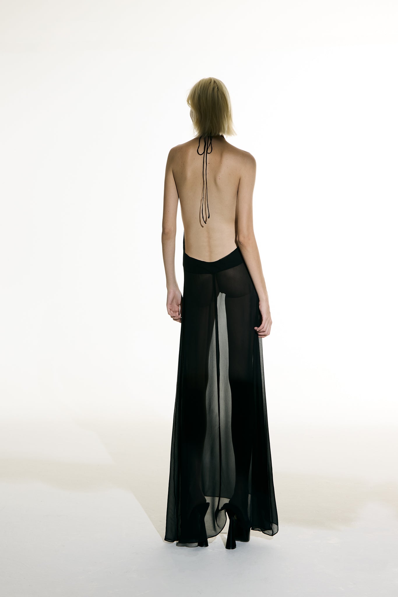 Model wearing the Open Back Slip Dress back from the Adriana Degreas and Sabine Getty collab with 100% Silk styled for a date night look.