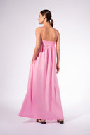 Model wearing the Opulence Straps Maxi Dress back color light pink made with 97% Cotton 3% Elastane,  styled for a lunch look 