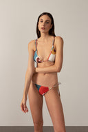 Model wearing the Organic Floral Triangle Bikini with unique color made from 85% Polyamide 15% Elastane, styled for a beach look