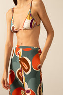 Model wearing the Organic Floral Wide-Leg Pants detail with unique color styled for a beach look