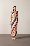 Model wearing Organic Stripes Frilled Long Dress front color unique, made from 85% Polyamide 15% Elastane, styled for a resort look.