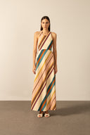 Model wearing the  Organic Stripes Halter Long Dress unique color front from the HS25 with 97% Cotton 03% Elastane styled for a lunch look.  