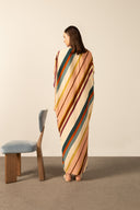 Model wearing the Organic Stripes Long Kaftan unique color back from the HS25 with100% viscose styled for a lunch look.   