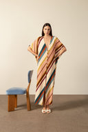 Model wearing the Organic Stripes Long Kaftan unique color pose from the HS25 with100% viscose styled for a lunch look.   
